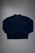 lat lay of a dark raw denim jacket with metal button closure, structured collar, contrast stitching and wide sleeves. - Motor Cycle Brut