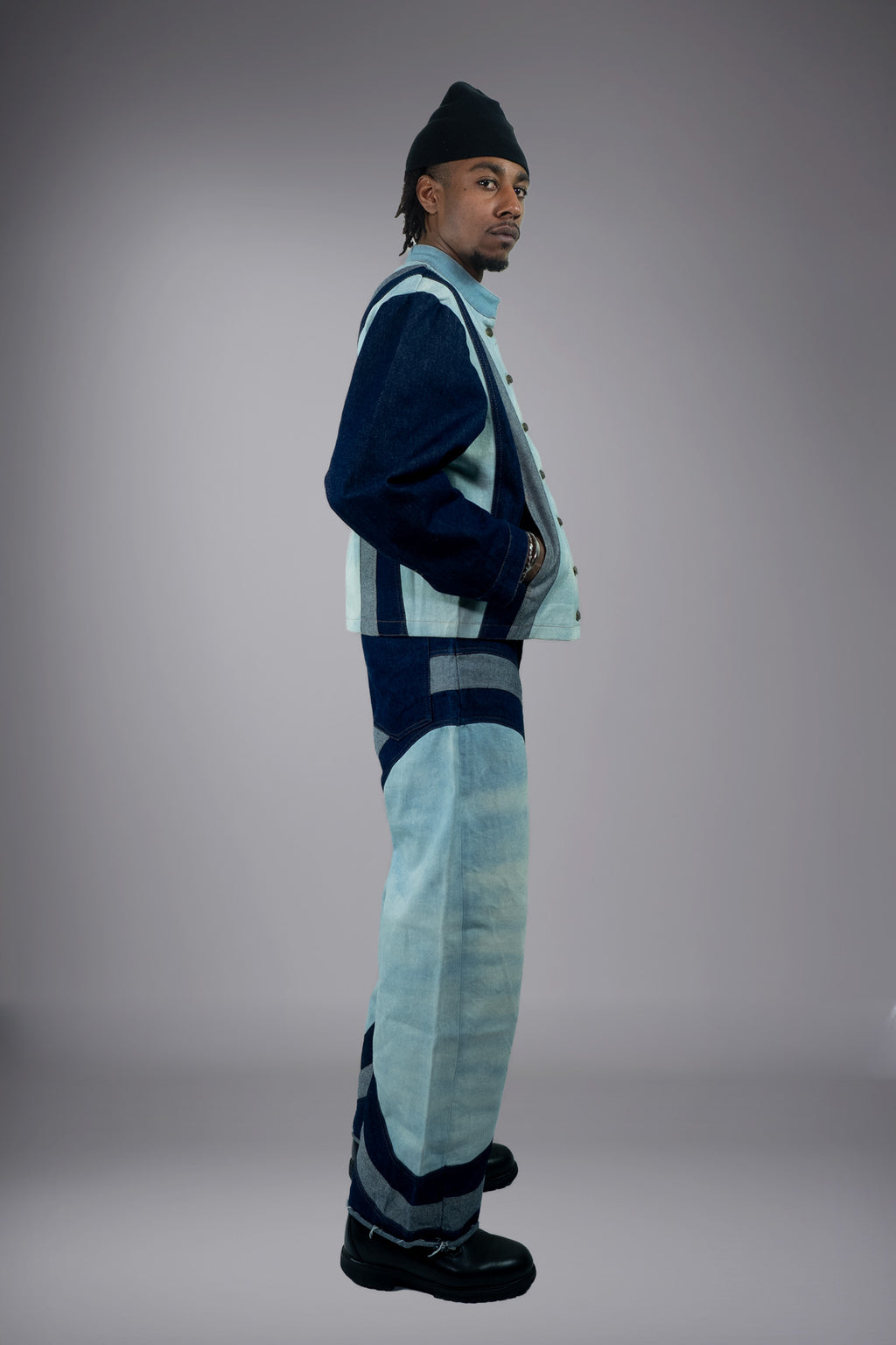 Side view of a two-tone denim jacket and matching wide-leg jeans with light wash panels and dark curved inserts. - Motor Cycle Triple Jean