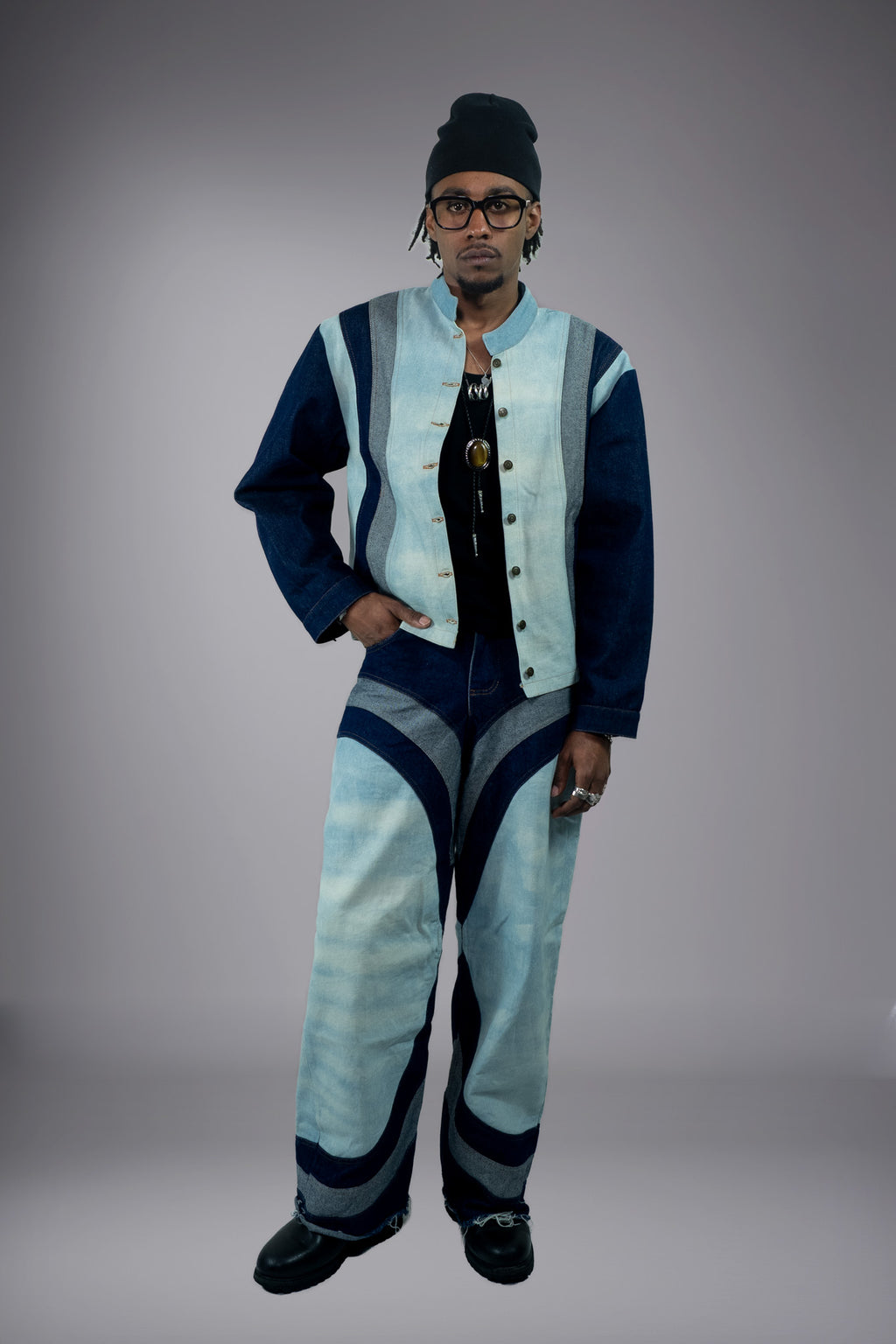 Full-body front view of a two-tone denim jacket worn open with matching wide-leg jeans and curved panel details. - Motor Cycle Triple Jean